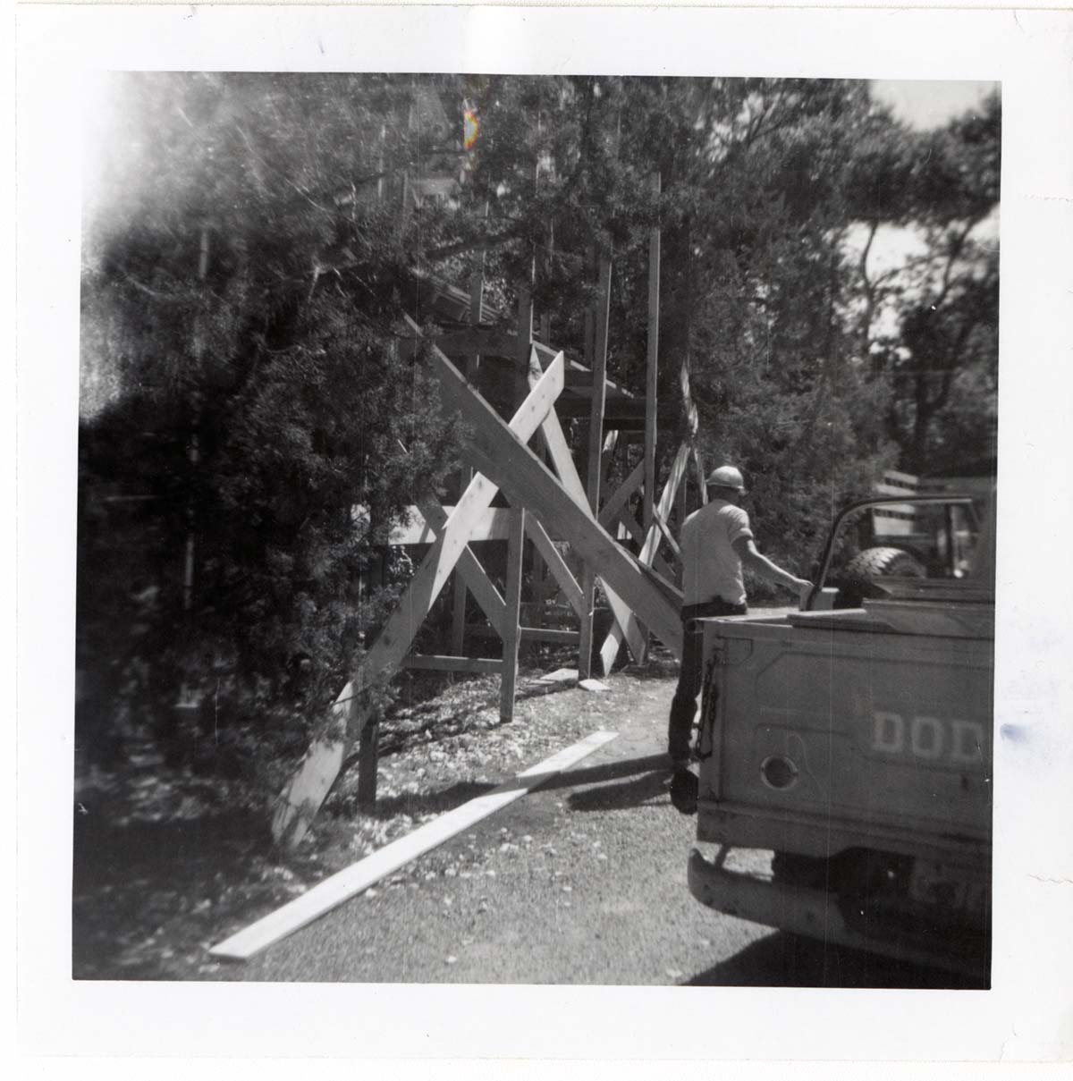 Construction activity - preparing lumber/scaffolding.