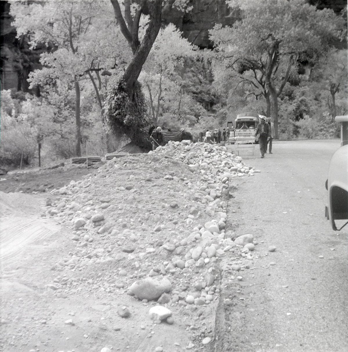 Men performing road work along the scenic canyon drive near the Grotto.
