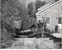 Road repair - near ranger dorm. Paving machinery at work laying hot mix.