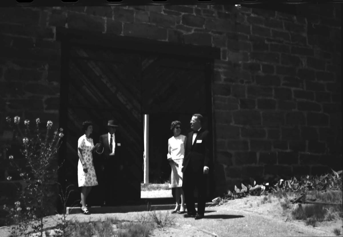 Arizona Governor Jack Williams and Mrs. Jack Williams (right), Fredonia Mayor Judd and Mrs. Judd (left) standing at the east entrance to Winsor Castle fort. They visited Pipe Spring following the dedication of Arizona State Highway 389, Fredonia, Arizona, August 5, 1967.