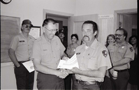 BW Photos of Superintendent Harold Grafe giving out awards to park personnel.