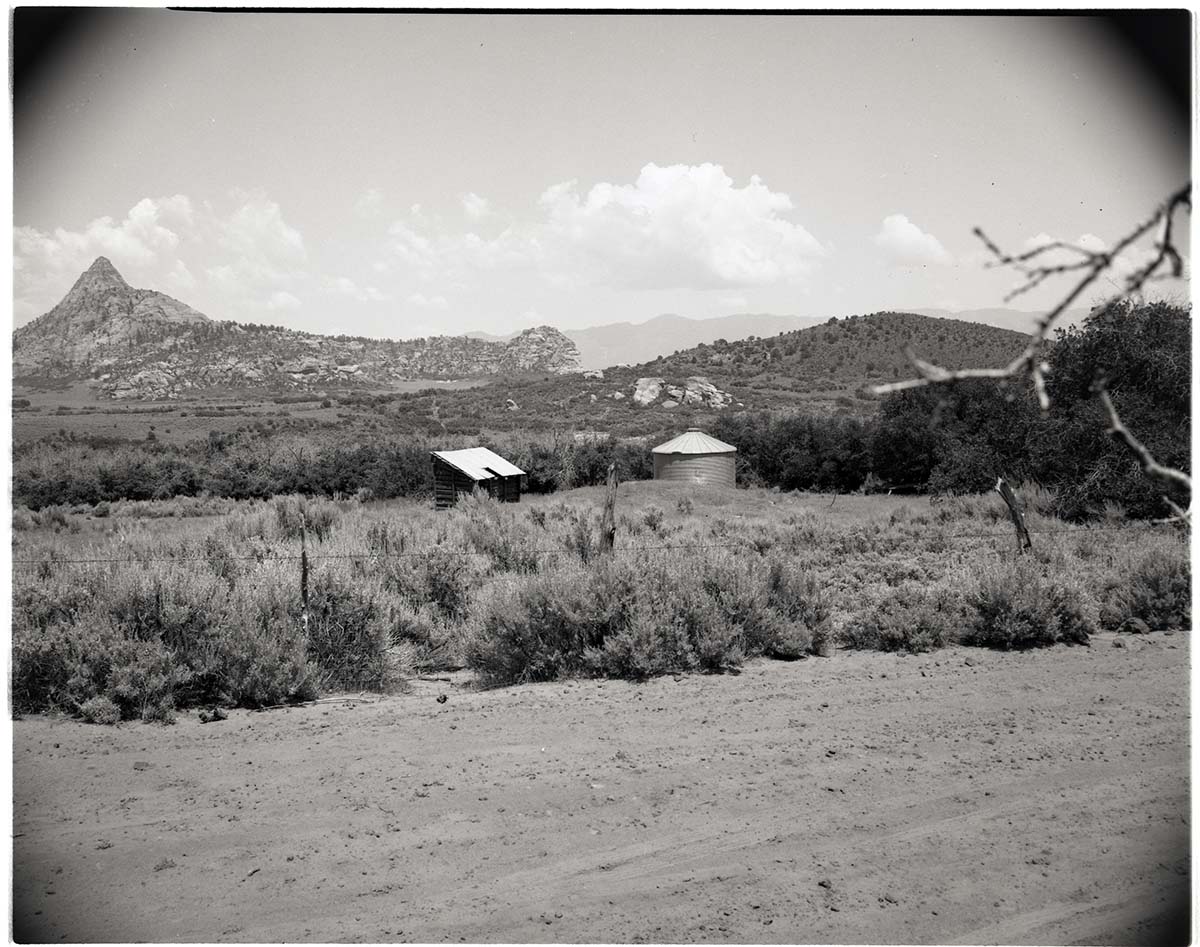 BW photo of the 1937 grazing study - 4x5. Building and tank.
