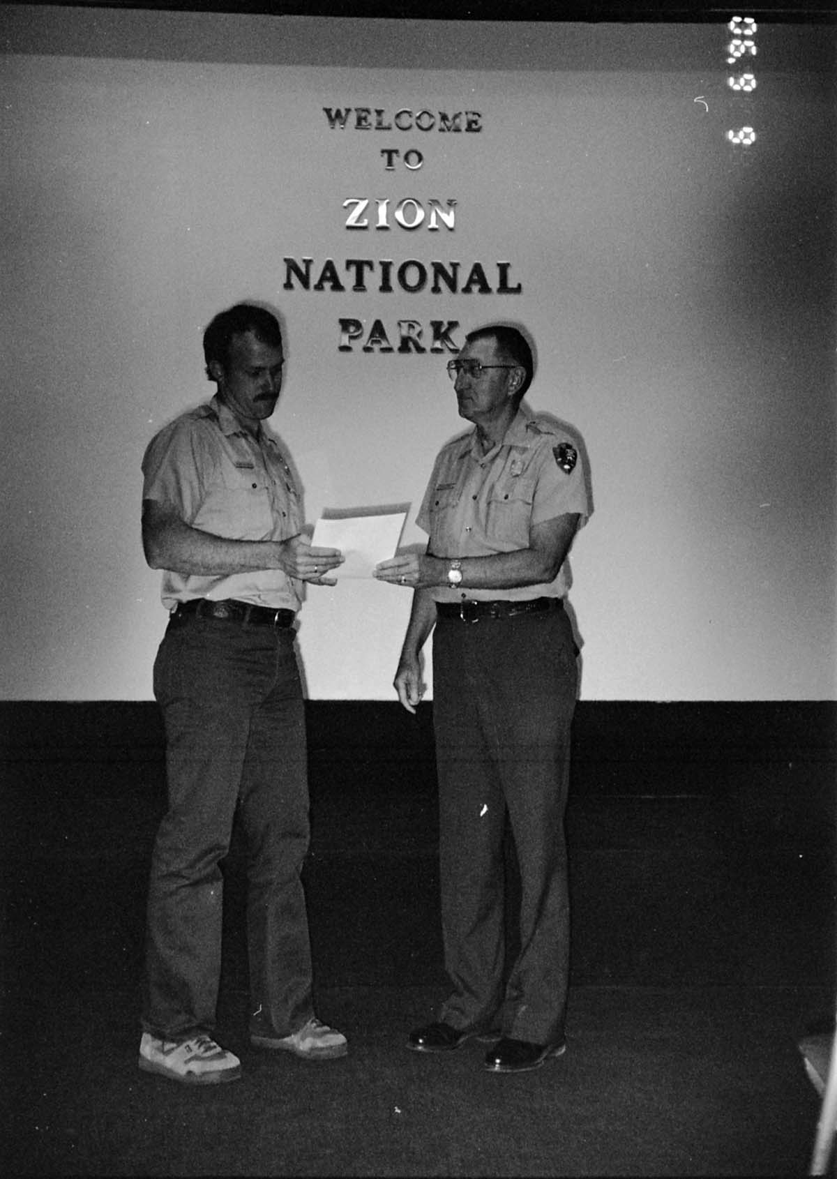 BW Photos of Superintendent Harold Grafe giving out awards to park personnel.