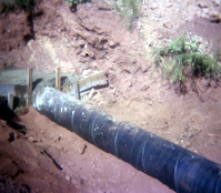 Color Photo of a rock slide along road.