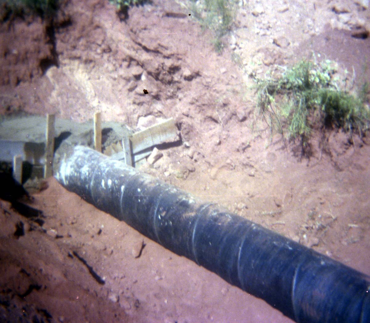Color Photo of a rock slide along road.