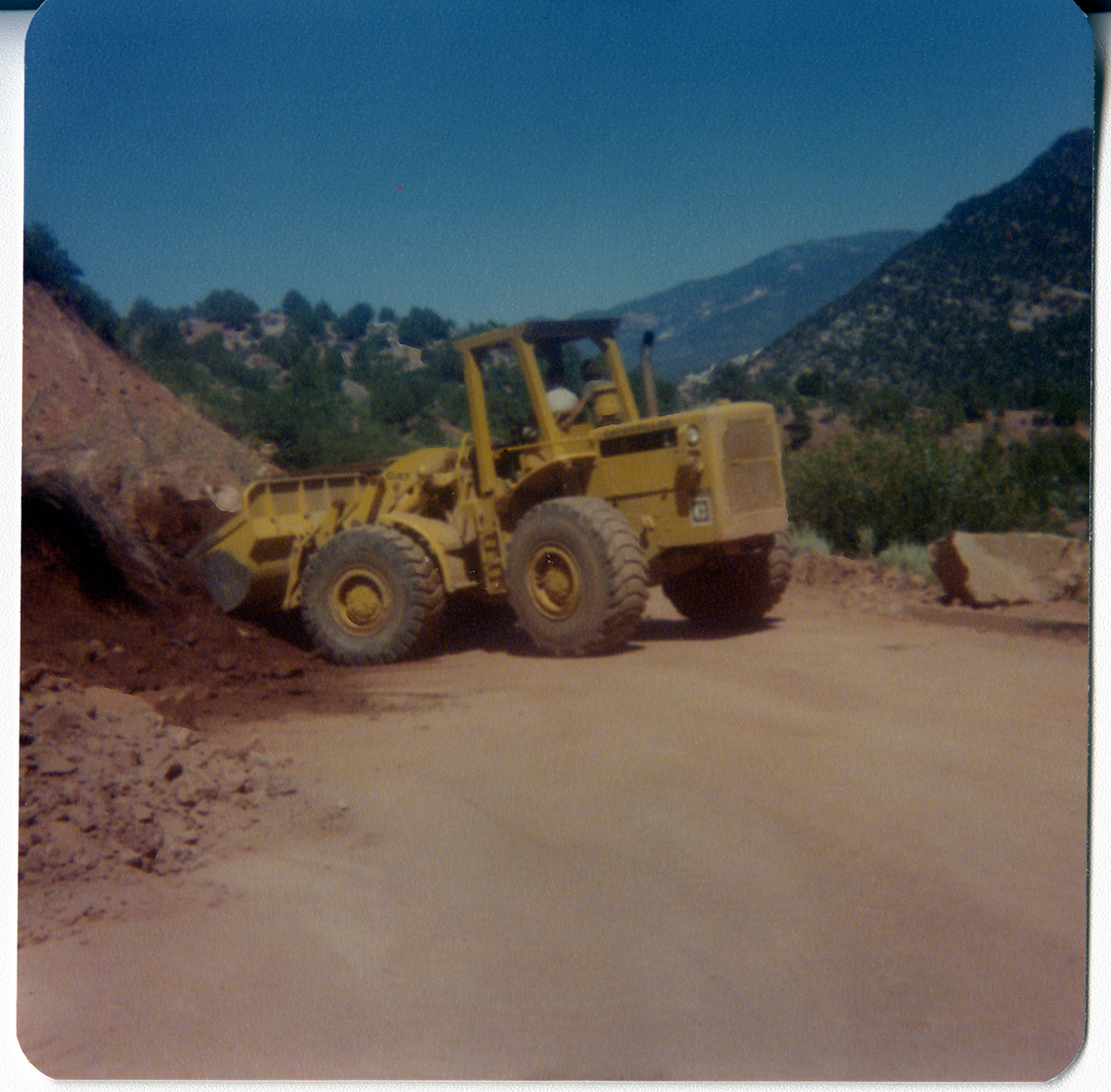 Excavator clearing road for road work/repair in Kolob Canyon.