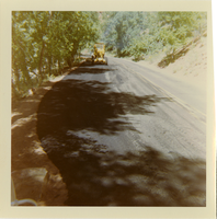 Tractor performing shoulder work along route 2 parking areas.