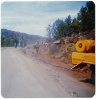 Men clearing rocks along the Kolob Terrace Road during construction.