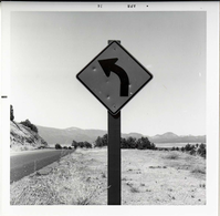 Left curve ahead road sign in Kolob Canyon.