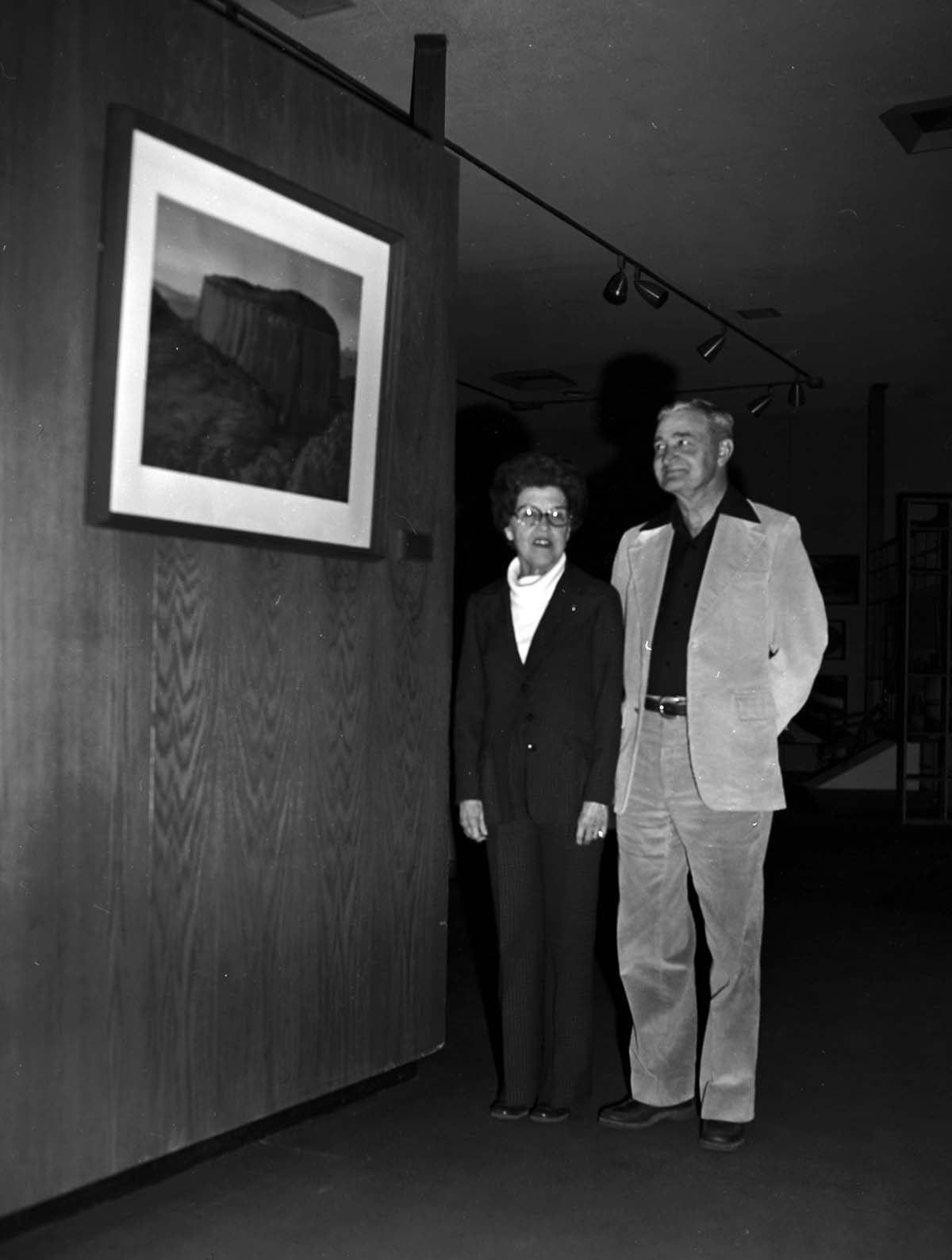 Dr. W. Larson presents plaque and painting to Mrs. Ethel Farnsworth in memory of her husband Dr. Reed Farnsworth, who was a Zion Natural History Association (ZNHA) board member. The painting is of Timbertop Mountain by Leek.