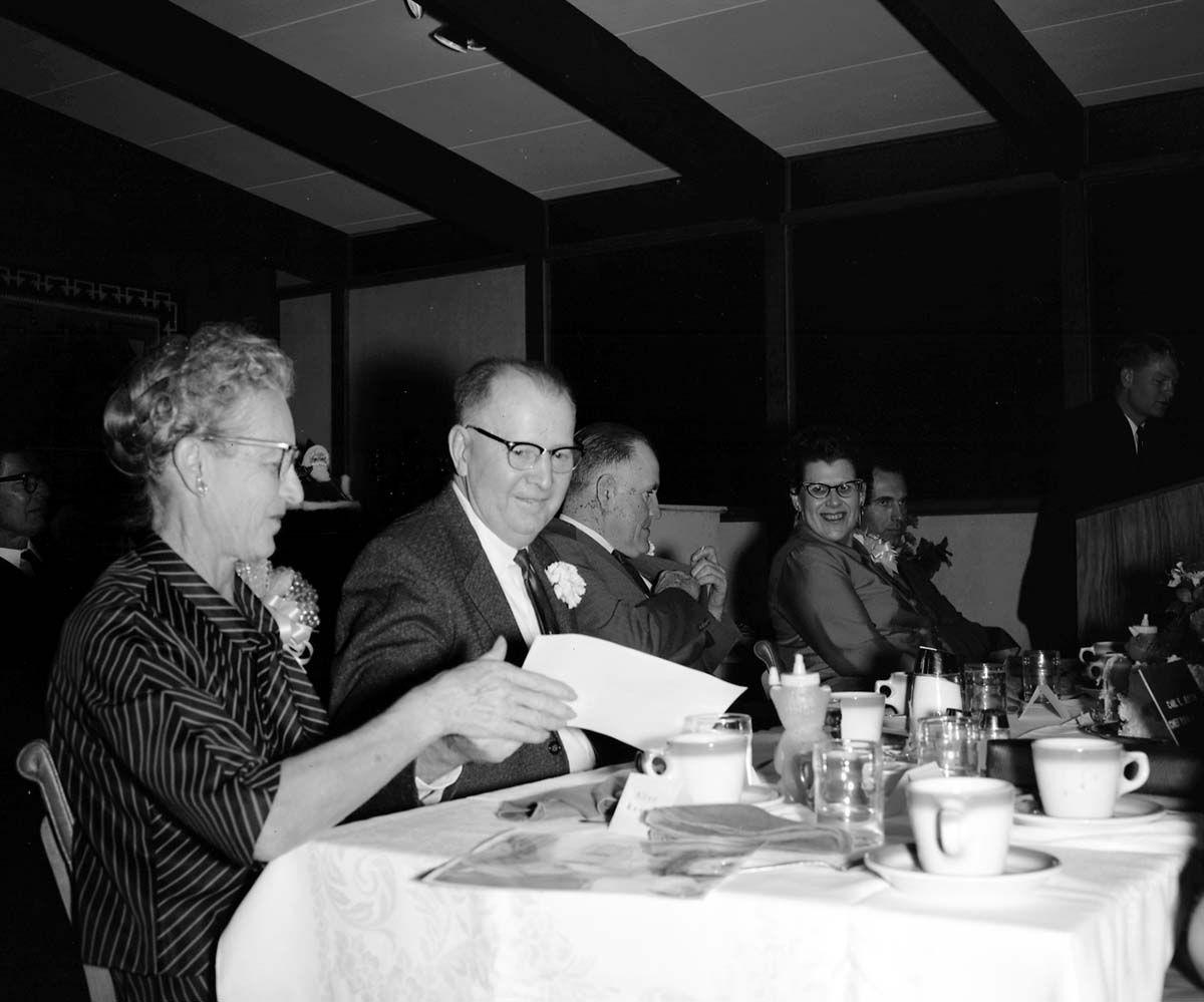 Retirement party for Carl E. Jepson and Rudy Lueck at Grandma's Kitchen. Left to right: Ester Jepson, Carl E. Jepson, Rudy Lueck and Eulah Lueck.