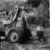 Tractor hauling rocks used for road work along the scenic canyon drive near the Grotto.