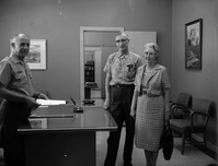 Superintendent Frank R. Oberhansley presenting certificate to Ernest and Stella Gisseman of Midvale, Utah, the Millionth Visitor to Zion National Park.