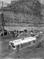 Stage set with long table for the 'Last Supper,' part of the 1939 Easter services in Zion Canyon. Located near the Bridge Mountain Civilian Conservation Corps (CCC) camp, east of Virgin River.