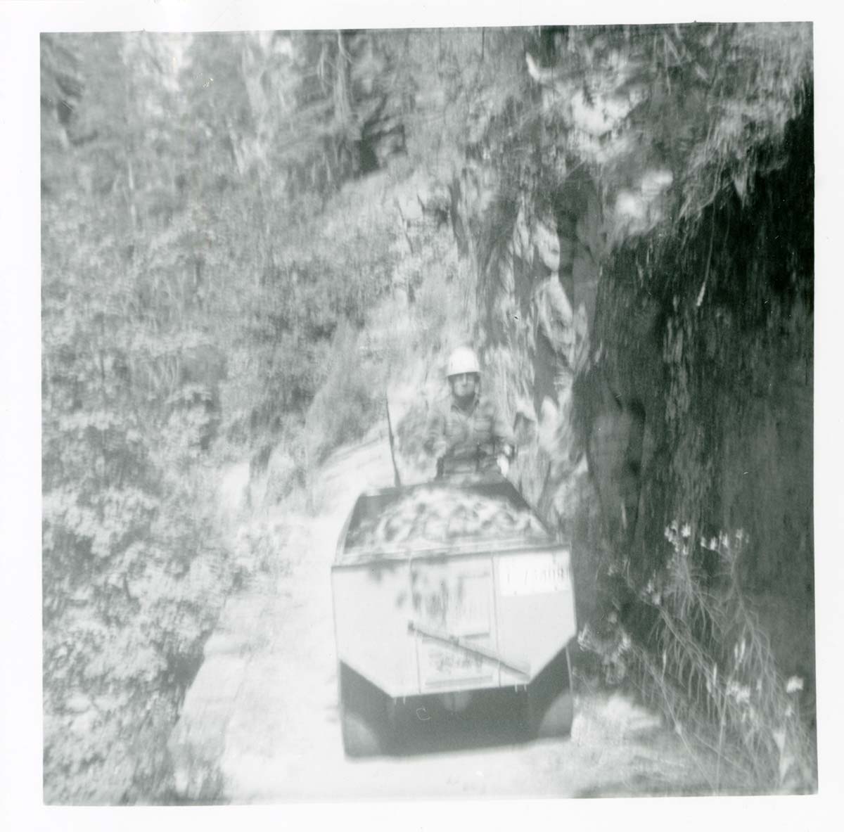Workers operating construction equipment during the West Rim trail half tunnel maintenance/stabilization.