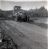 Tractor working during road grading to Chamberlain Ranch and the Narrows.