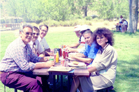 Color Photos of the parks 72nd anniversary celebrations- cake cutting, barbecue, speakers.