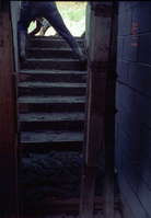 Man working on the building of a staircase during the construction of headquarters addition.