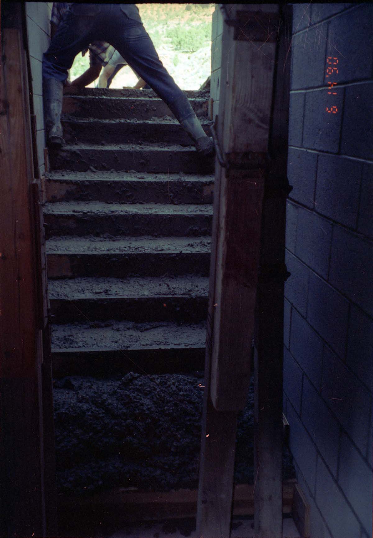 Man working on the building of a staircase during the construction of headquarters addition.