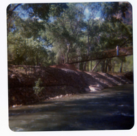 People walking on new Grotto footbridge over the Virgin River. Note riverbank revetments at left.