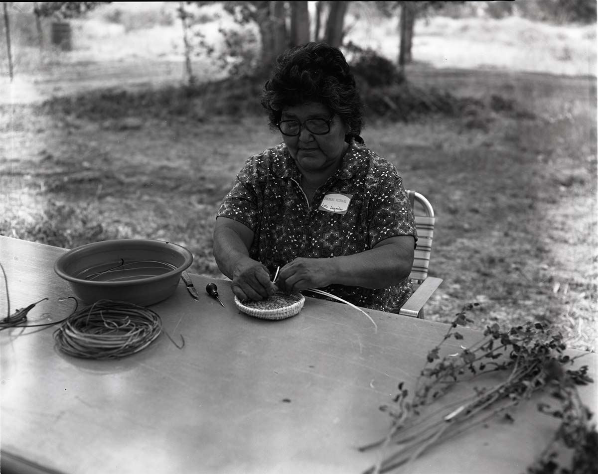 BW Photos of visitors, presenters, and activities at the folk life festival.