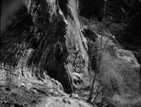 Weeping Rock. Handrail and rock wall masonry visible in foreground.