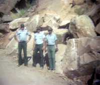 Color Photo of a rock slide along road.