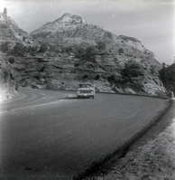 Truck driving down road during east side road repair and turn out construction.