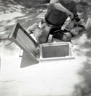 NPS personnel in maintenance yard doing tasks.
