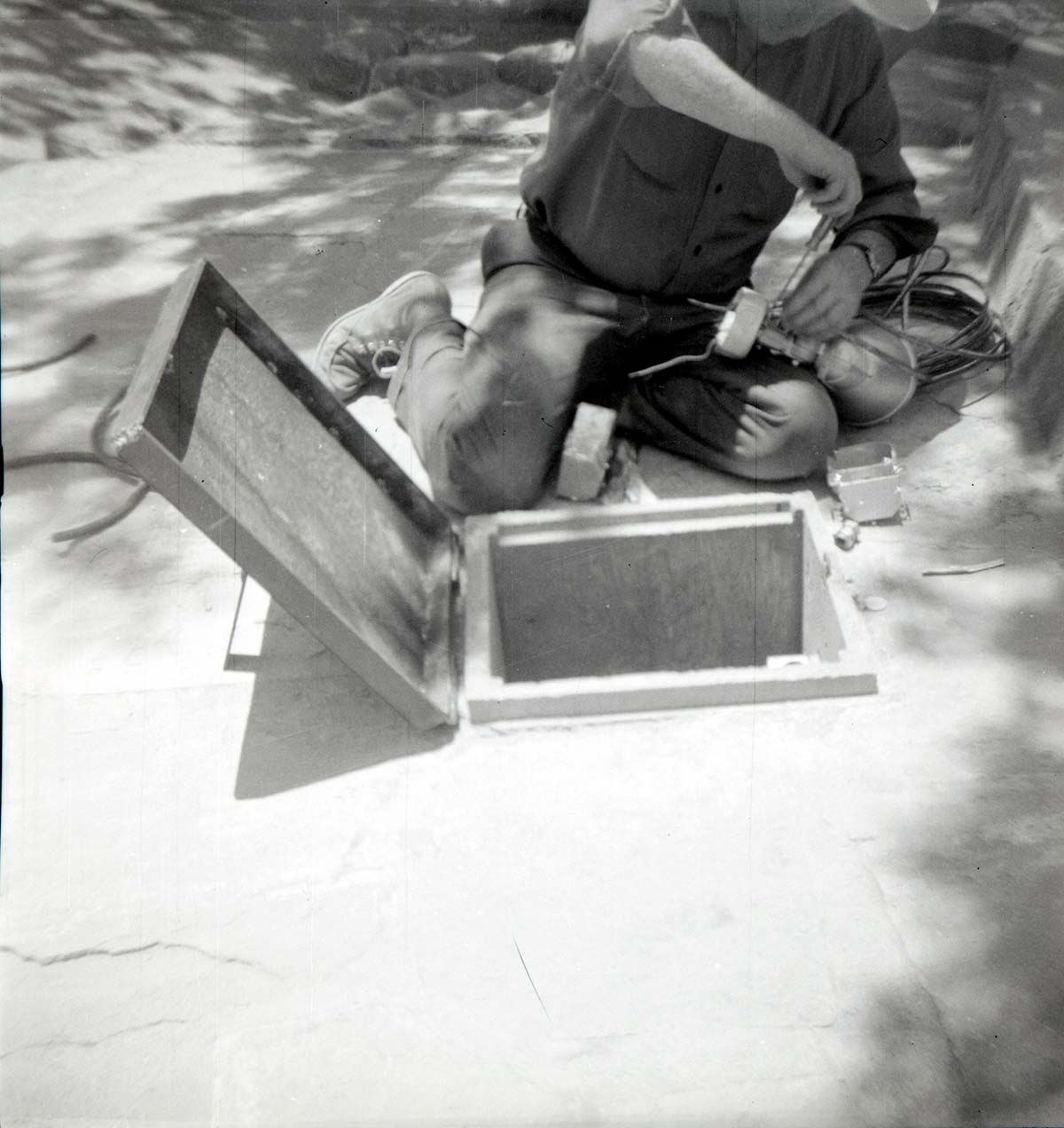 NPS personnel in maintenance yard doing tasks.