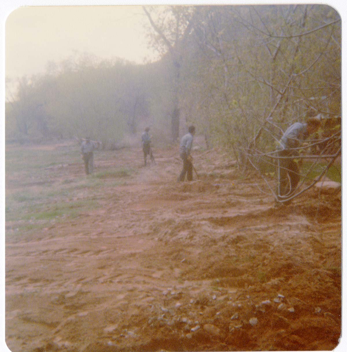 Workers uncovering the irrigation ditch in South Campground.