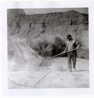 NPS employees clearing and removing brush with fire.