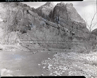 Pedestrian bridge over Virgin River on Emerald Pools Trail in front of Zion Lodge.