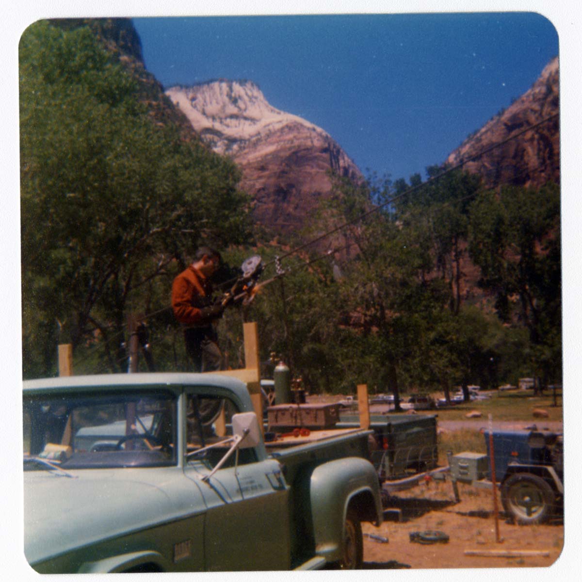 Worker setting up the tramline for the transportation of equipment for the construction of Wiley Tank.
