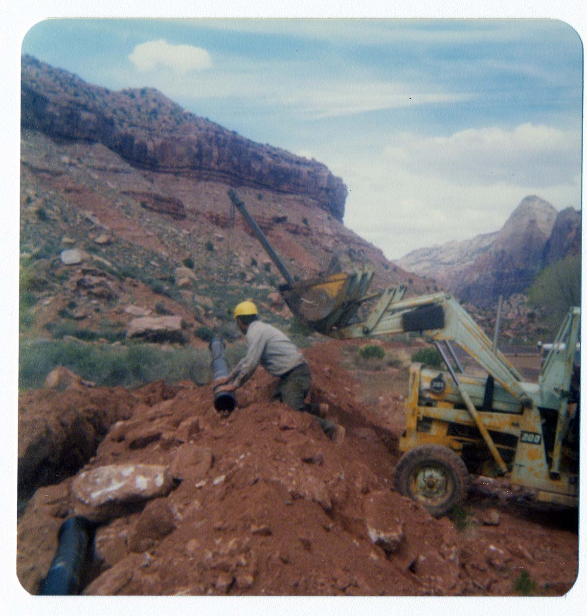 Men working on the construction of the Springdale water pipeline.