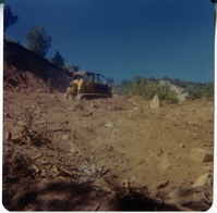 Construction vehicle clearing road for road work in Kolob Canyon.