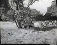 Auto accident 6 miles south of Zion Lodge. Car overturned just off road.