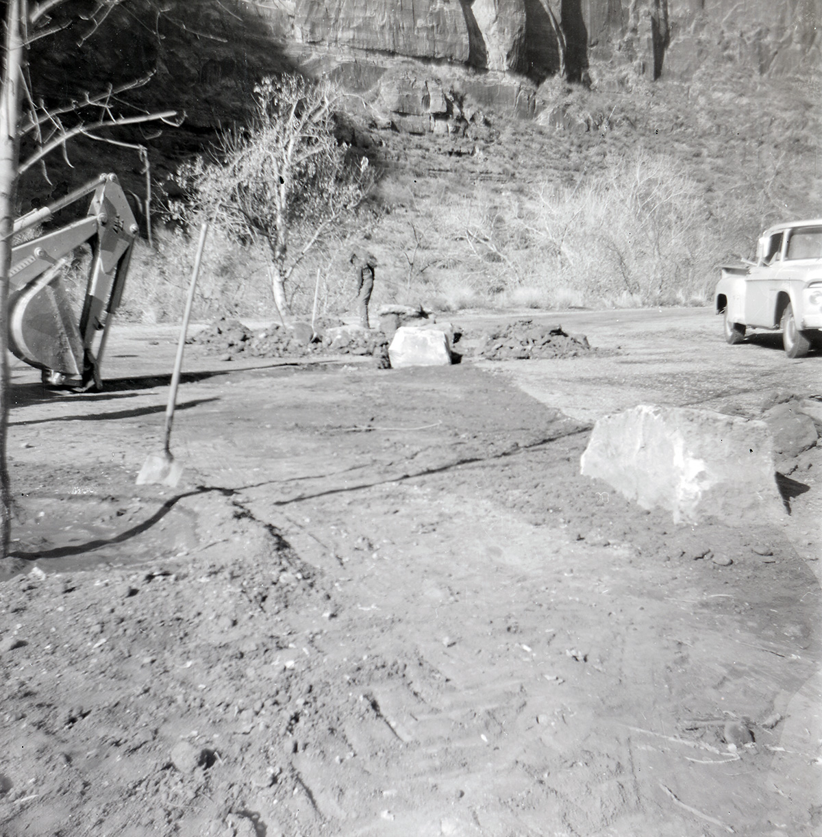 Man working on maintenance of the Great White Throne parking area during construction.