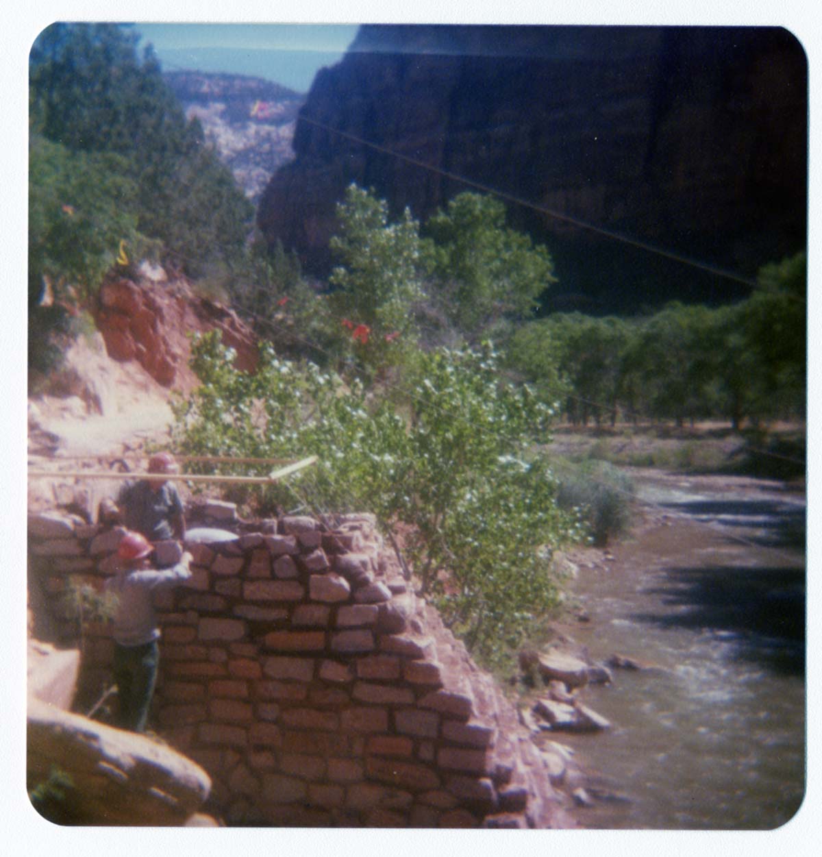 Men working on the emplacement of the new Zion Lodge footbridge.