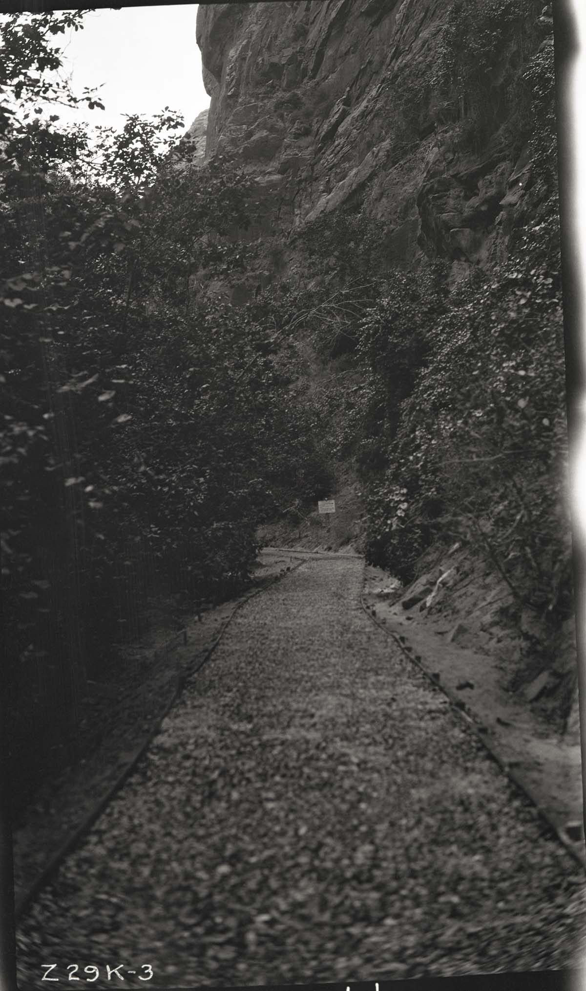 Narrows Trail construction with a view of the pavement base sprayed with bitumuls and rolled.