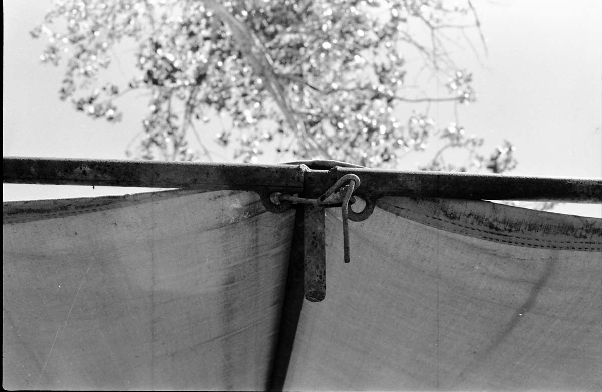 BW Photos of a close up of old tent hitching system.