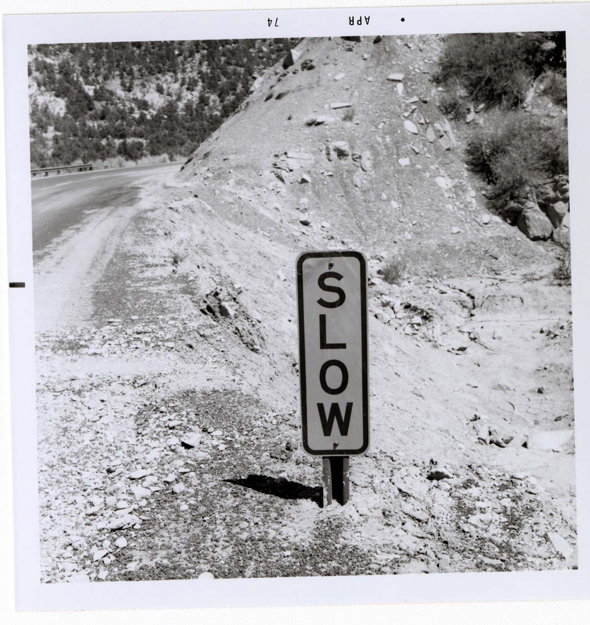 Road sign reading 'SLOW' in Kolob Canyon.