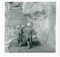 Workers operating construction equipment during the West Rim trail half tunnel maintenance/stabilization.