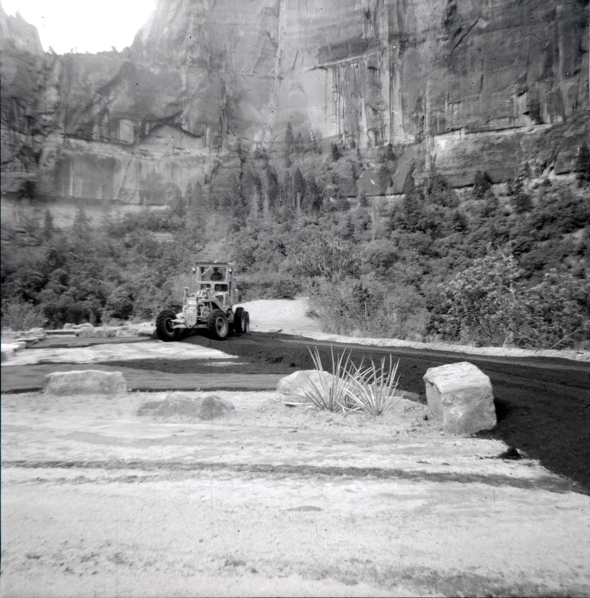 Tractor performing road work on the Great White Throne parking area.