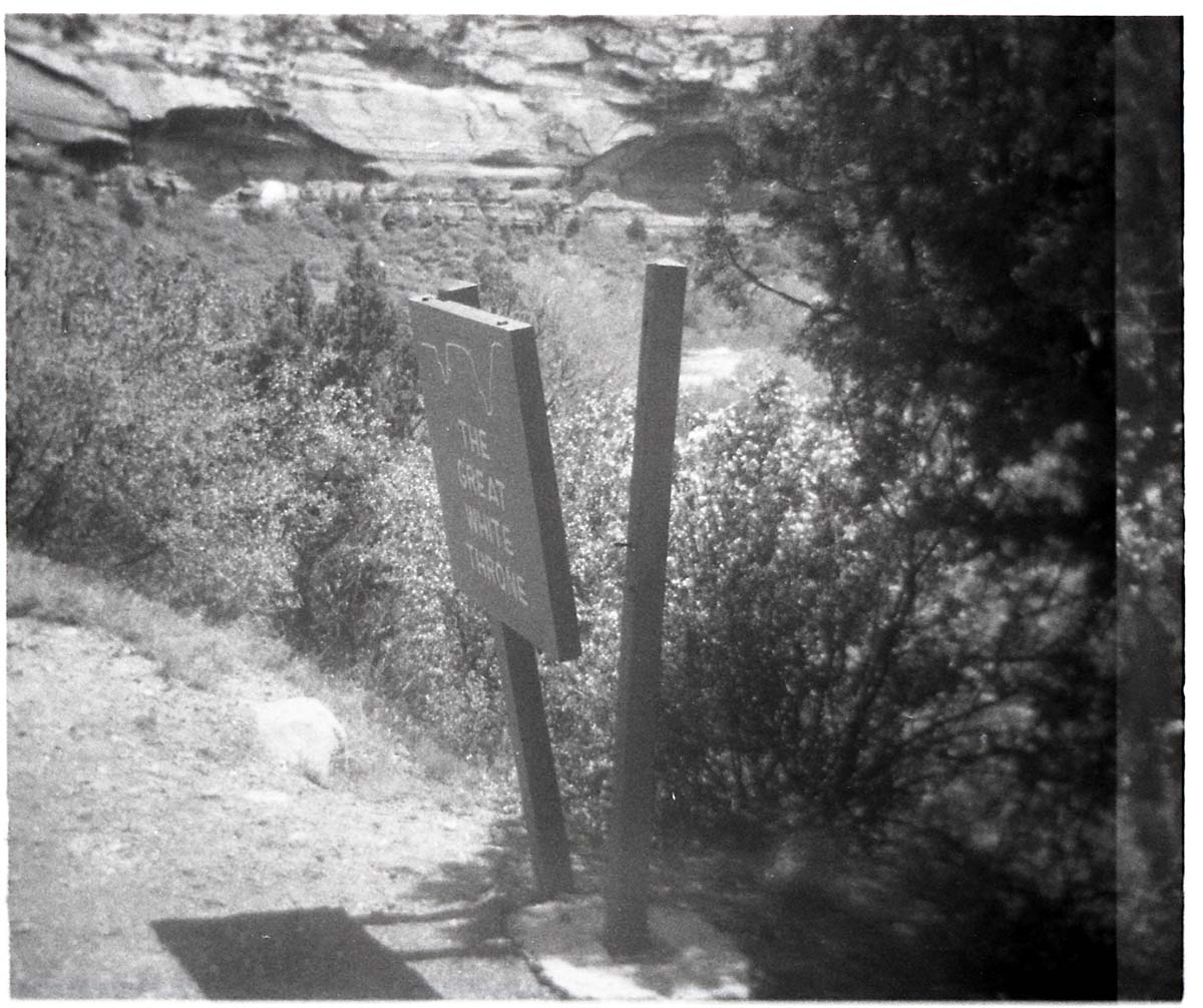 BW Photo of a rock slide along Route 2 - 110mm. Sign damage.